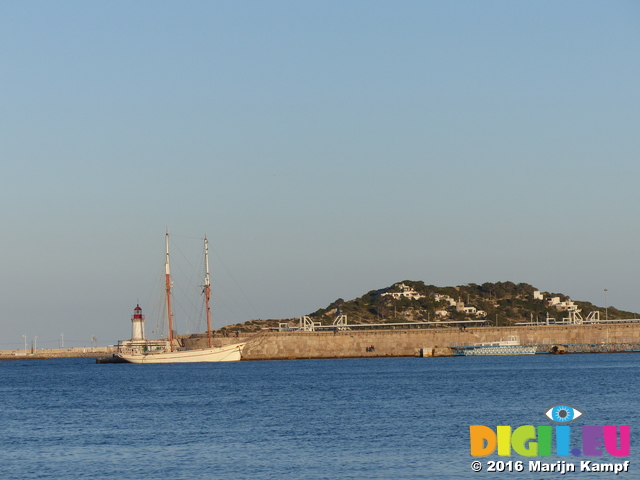 FZ027442 Old sailboat by lighthouse